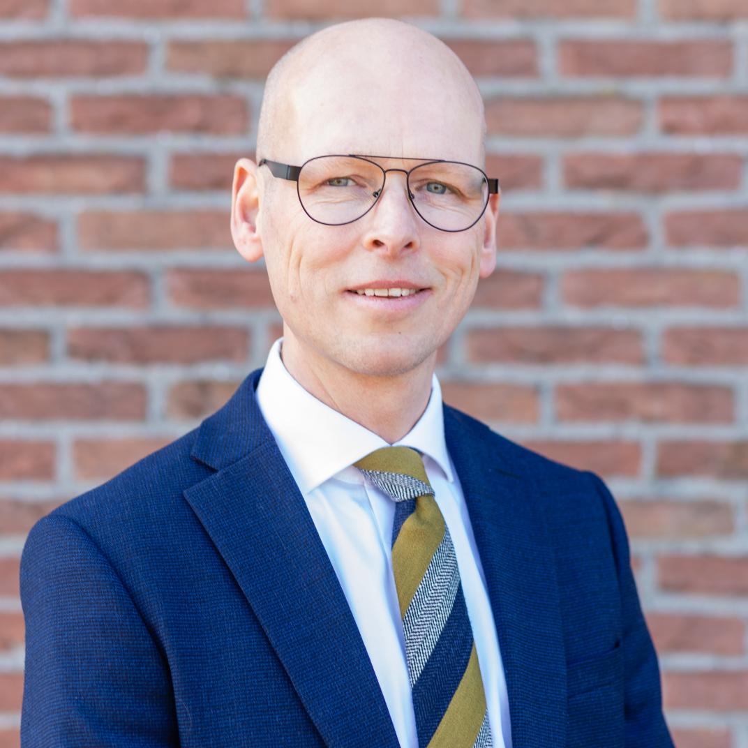 Wethouder M. Both